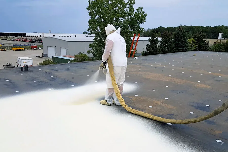 Commercial roof coating application by RISE Roofing Austin